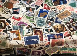 A colorful collection of various postage stamps from Canada.