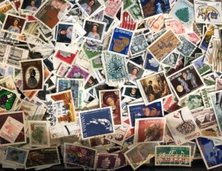 A colorful collection of various postage stamps from Canada