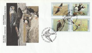 A postal cover featuring various bird-themed stamps and artwork.