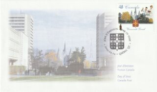 A scenic cityscape with a river and tall buildings under a clear sky.